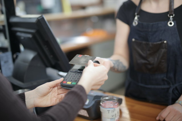 A client making a transaction at a counter